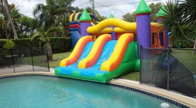 bounce_castle_with_double_slide_by_pool